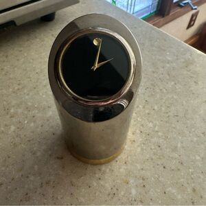 Movado Silver Cylinder Desk Clock with Black Dial and Gold Accents